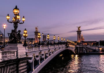 Pont Alexandre III with lights and a body of water