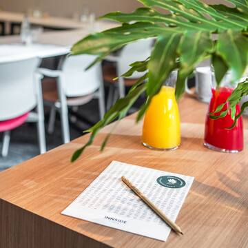 a table with a pen and a paper on it
