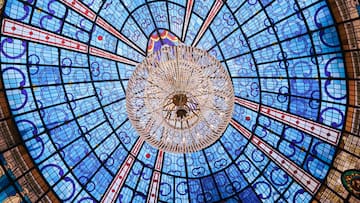 a chandelier in a blue and red ceiling