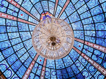 a chandelier in a blue and red ceiling