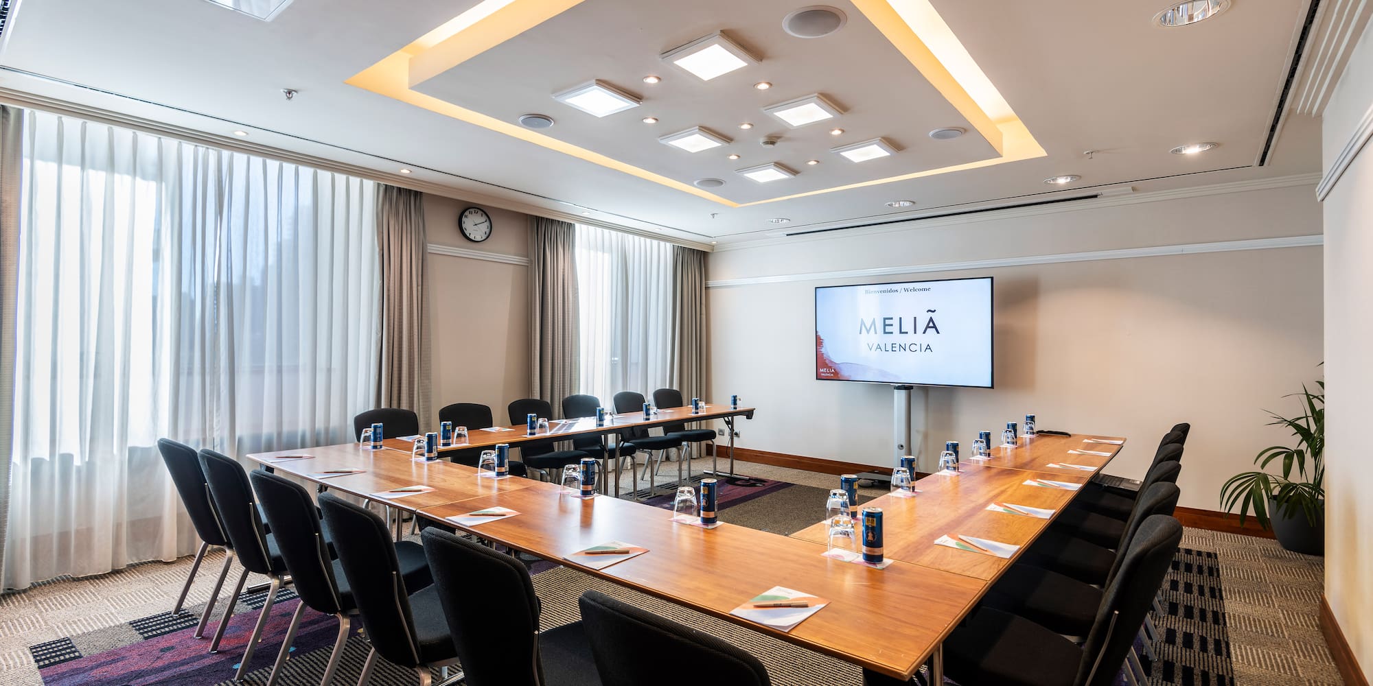a room with a large table and chairs
