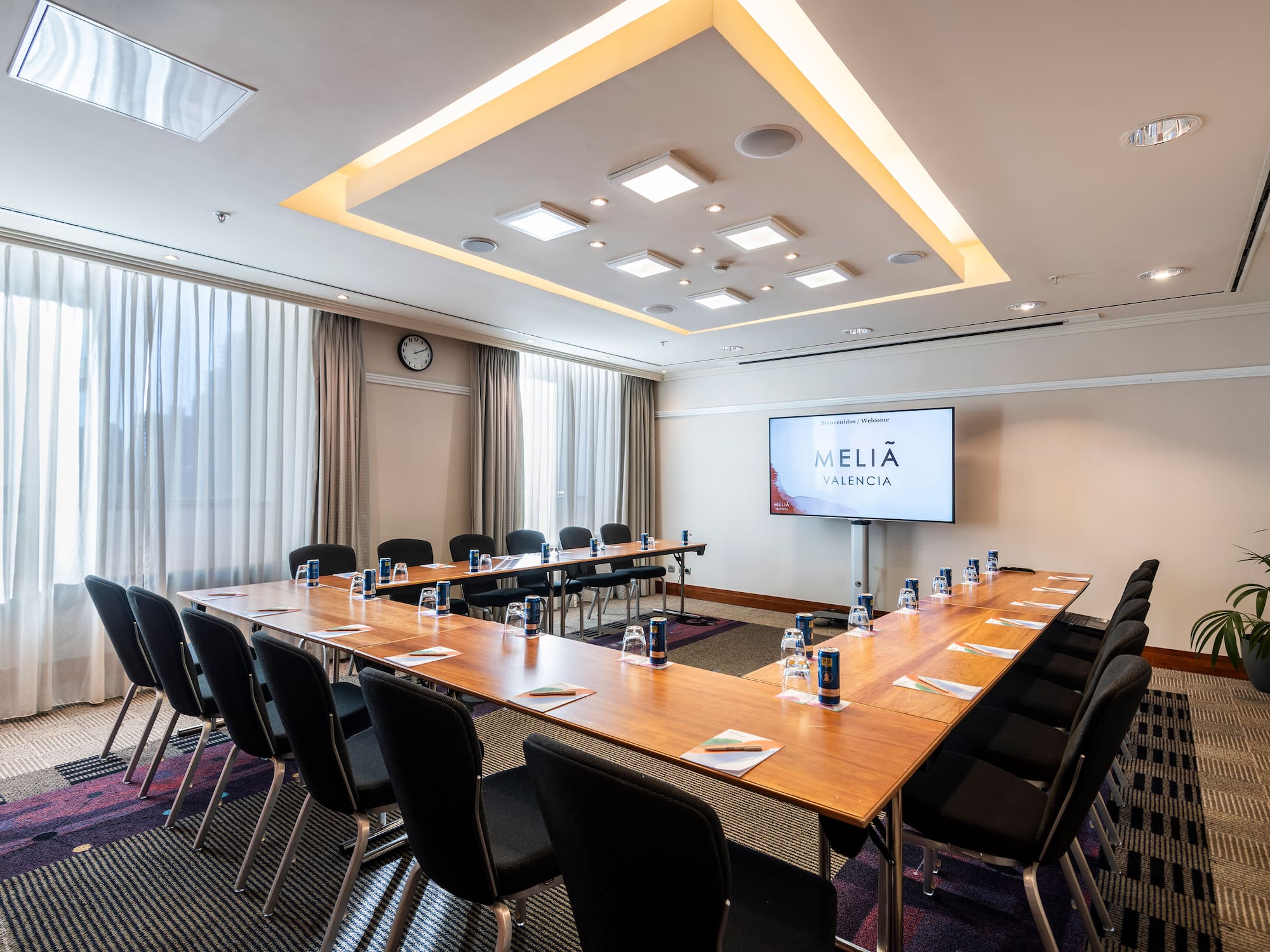 a room with a large table and chairs