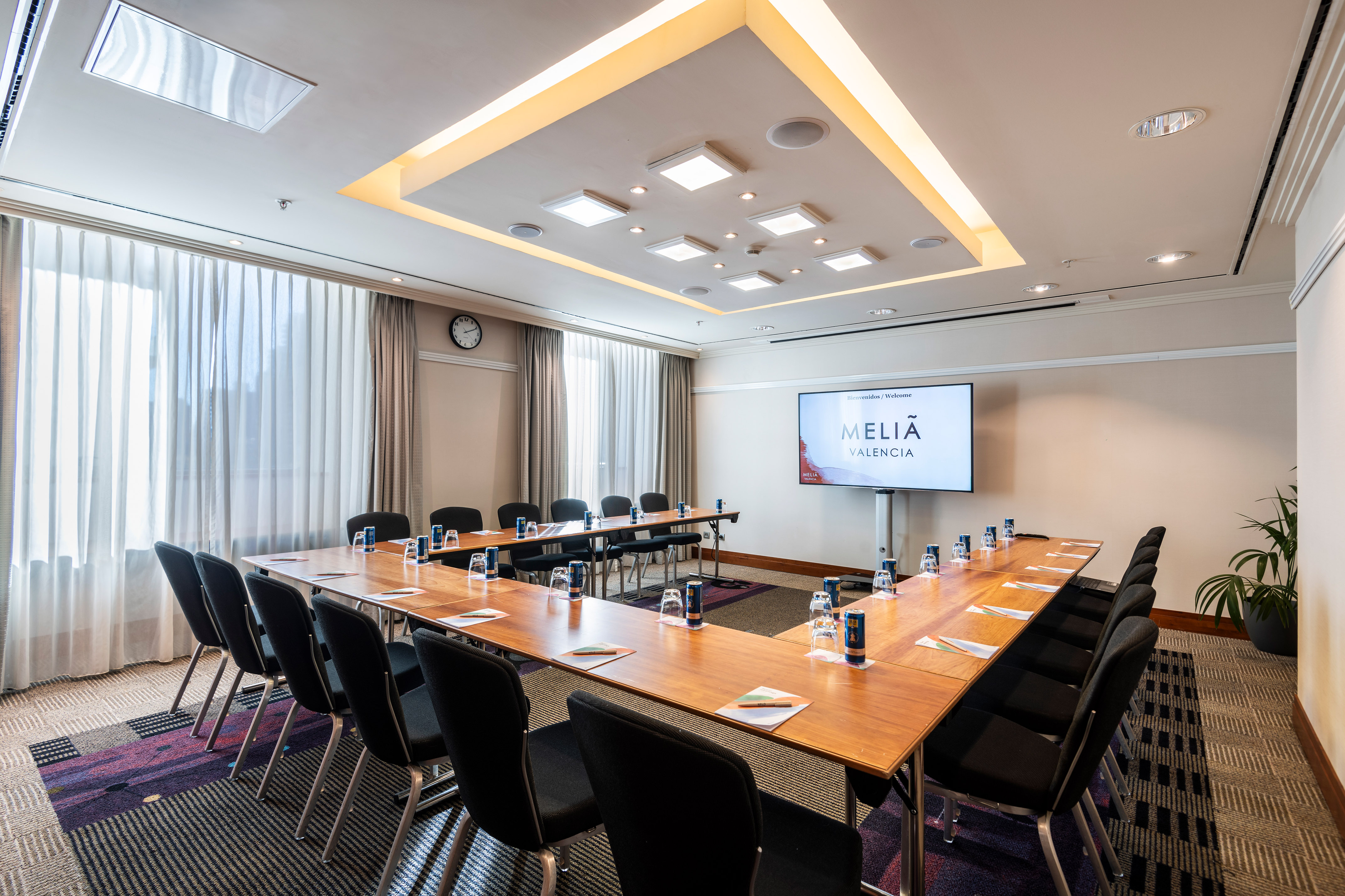 a room with a large table and chairs