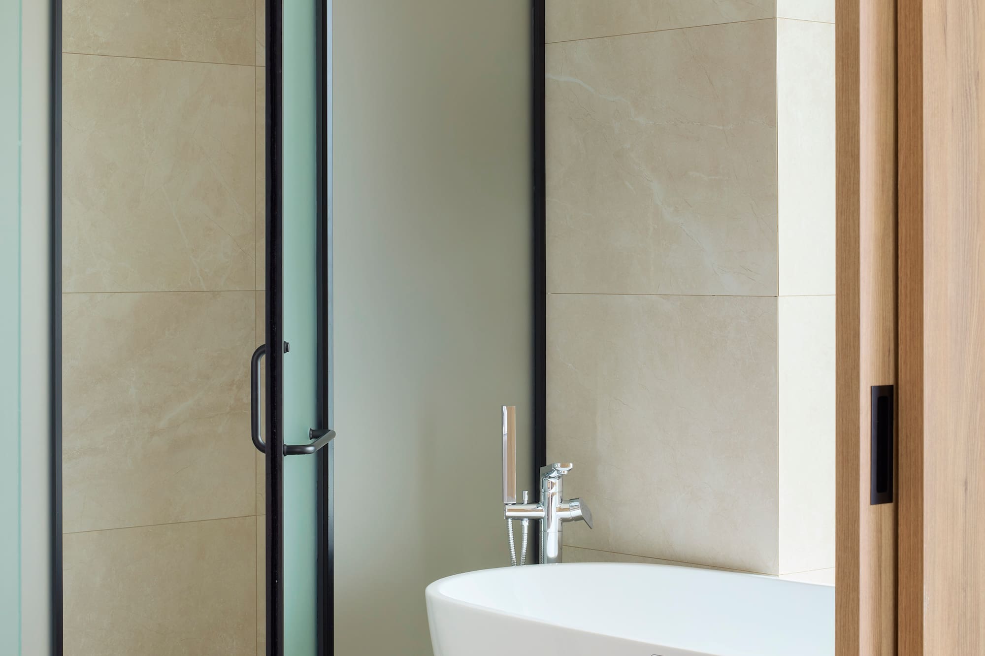 a bathroom with a glass shower door