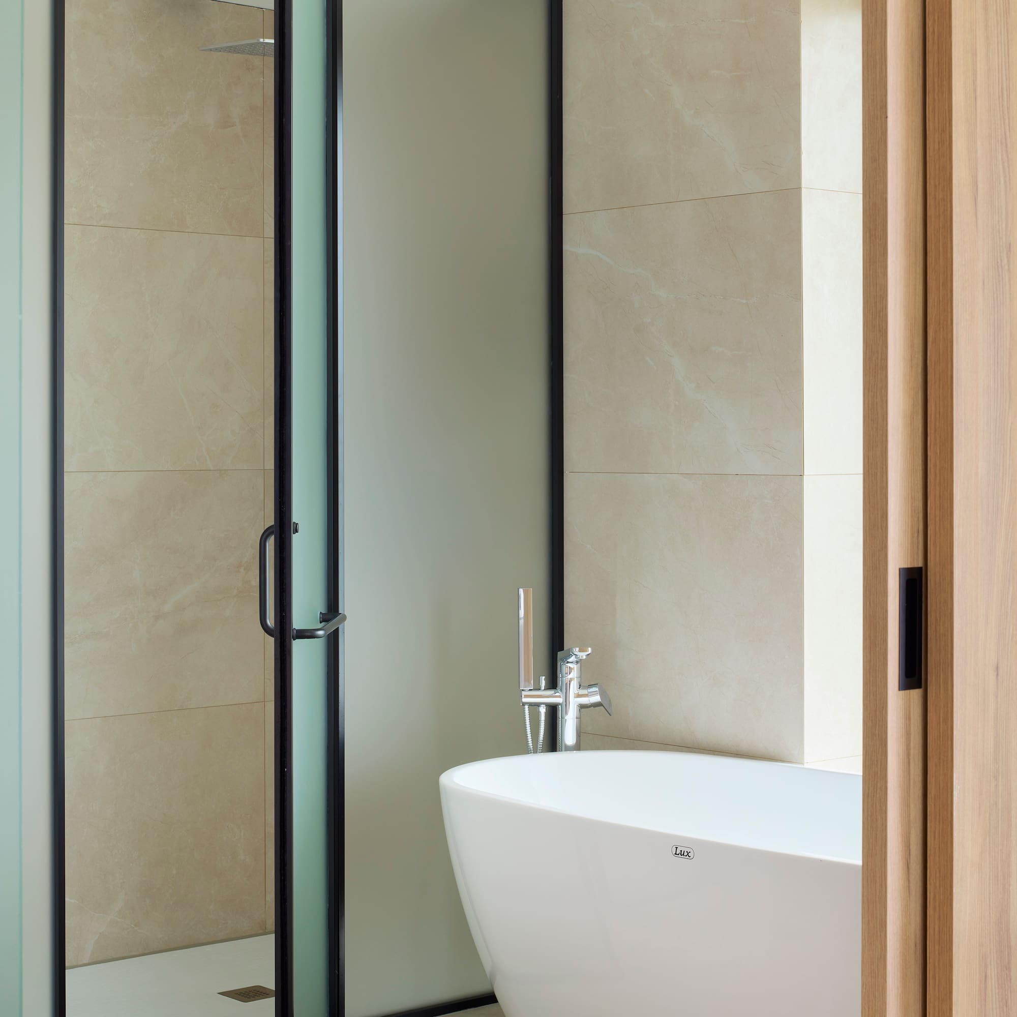 a bathroom with a glass shower door