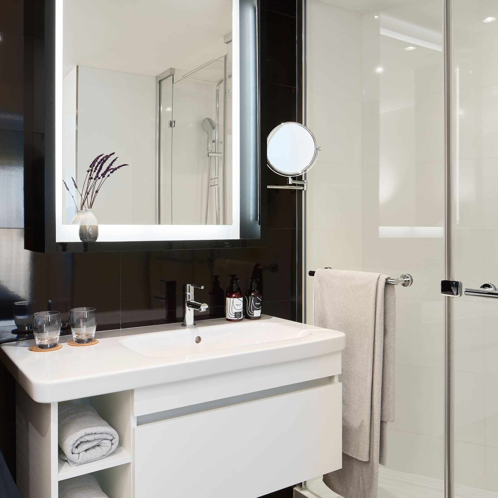 a bathroom with a mirror and a sink