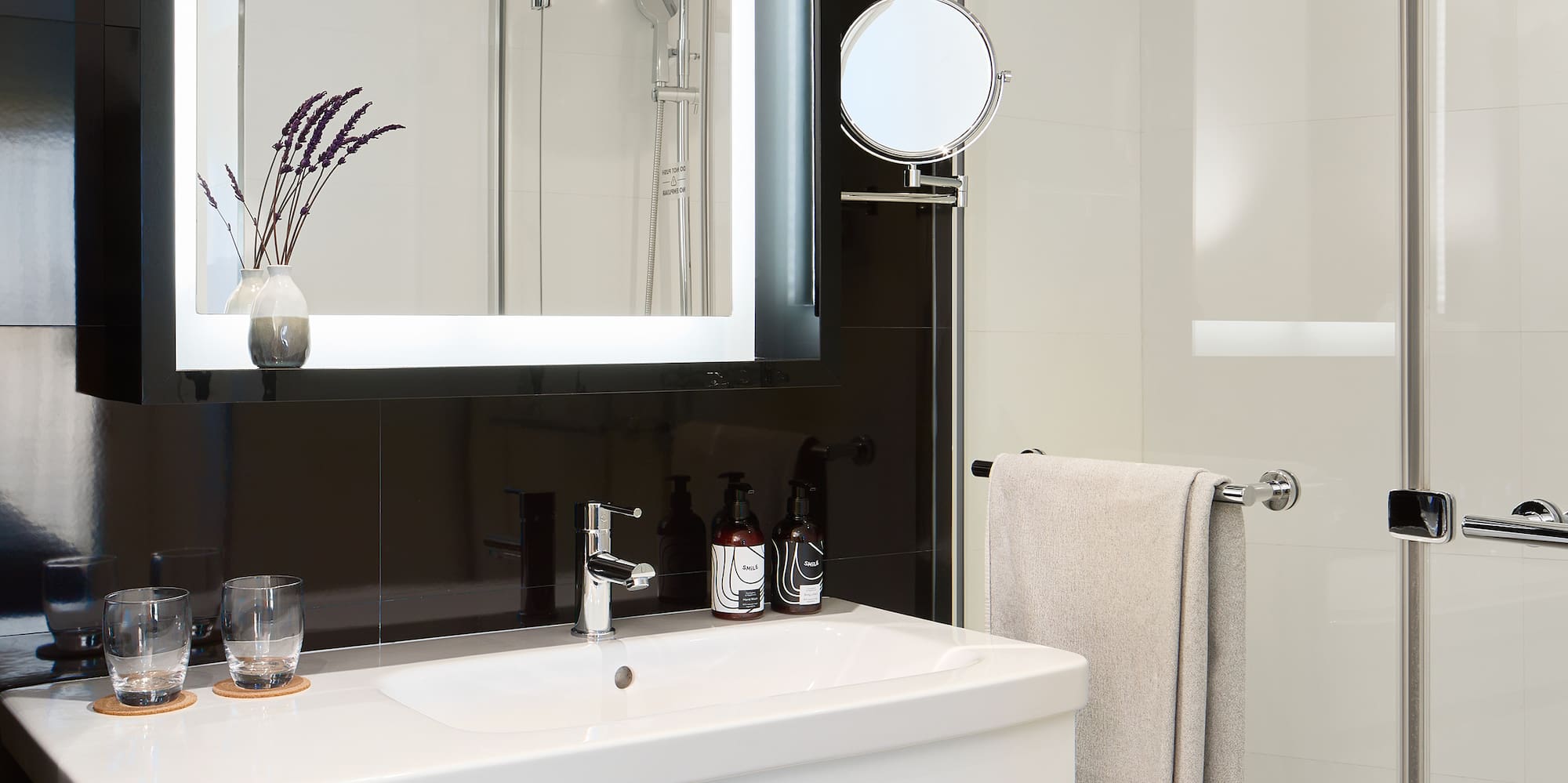 a bathroom with a mirror and a sink