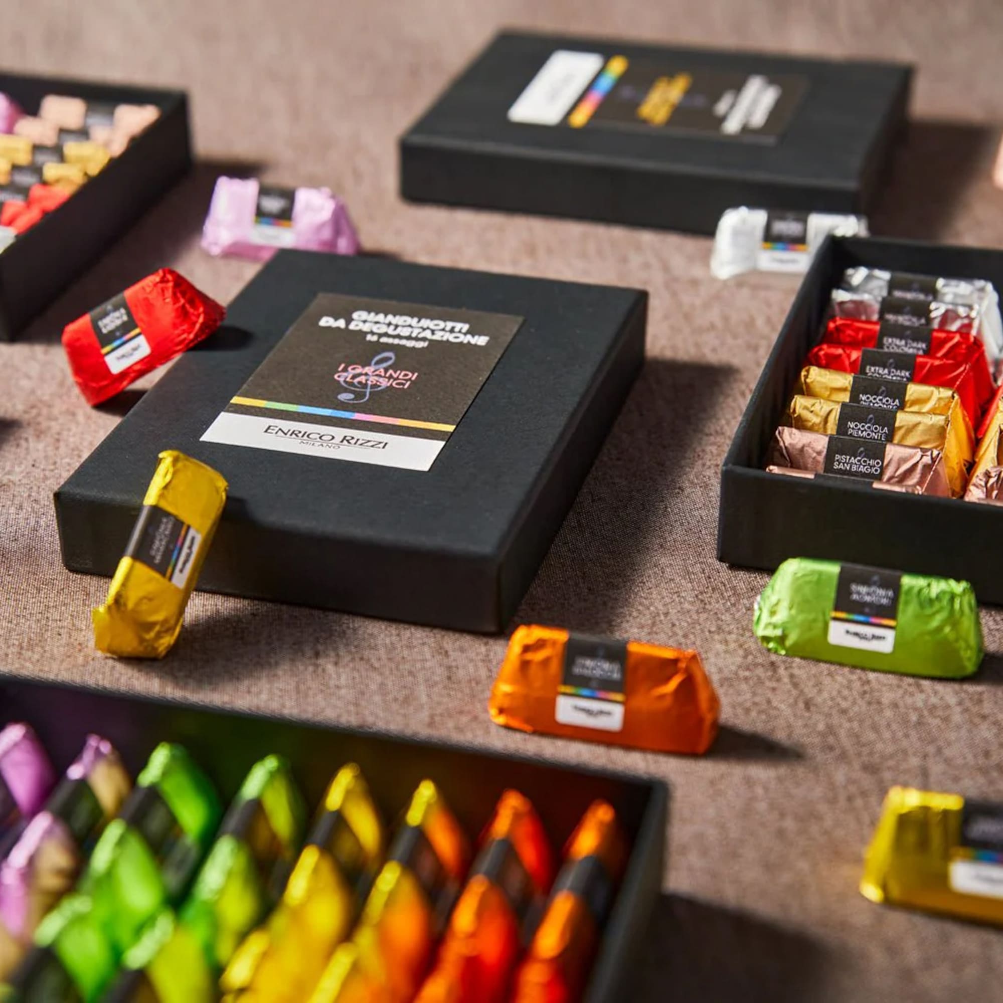 a group of different colored chocolates