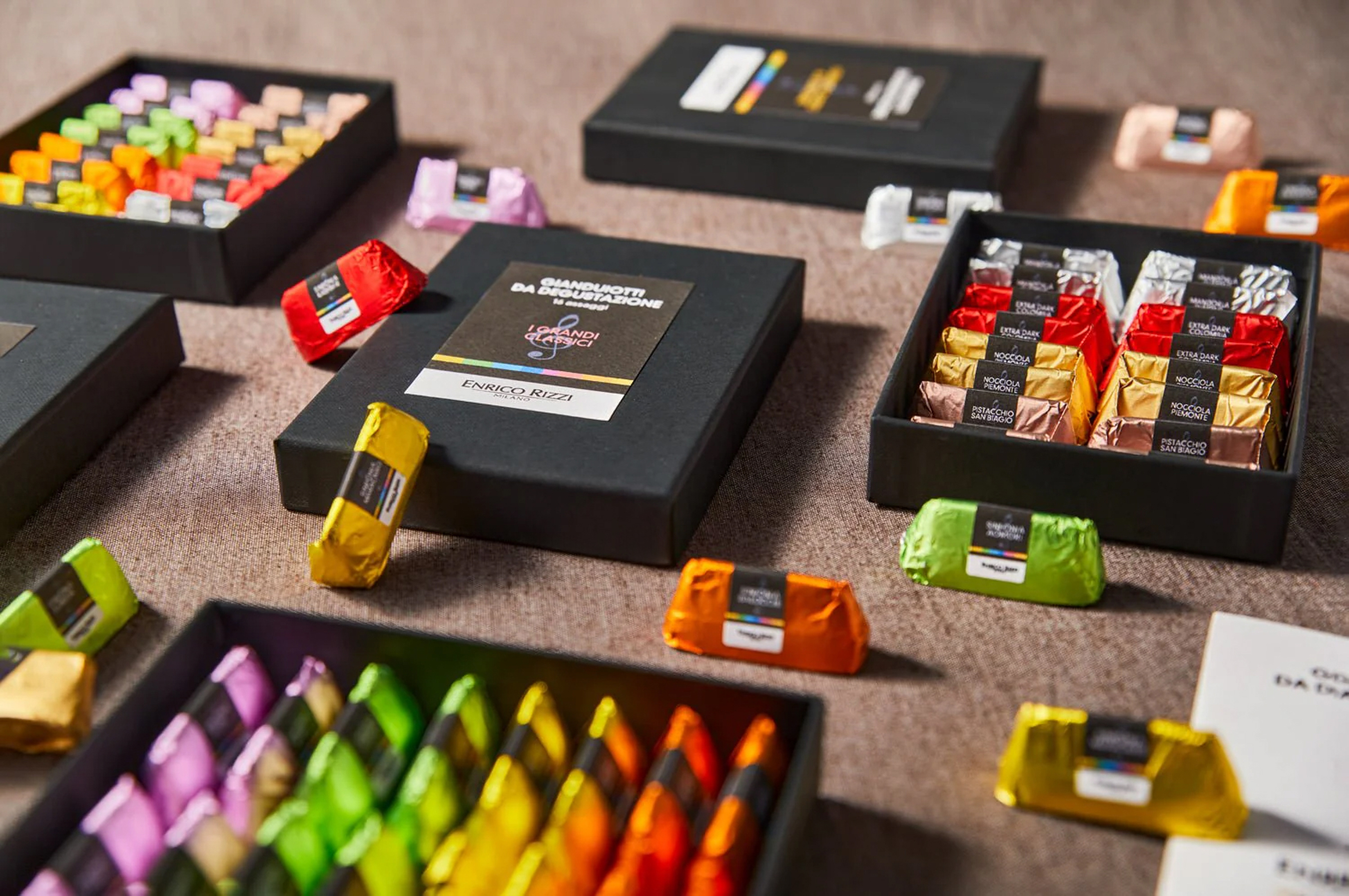 a group of different colored chocolates