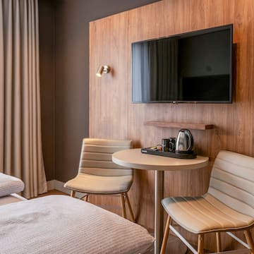 a room with a tv and a table