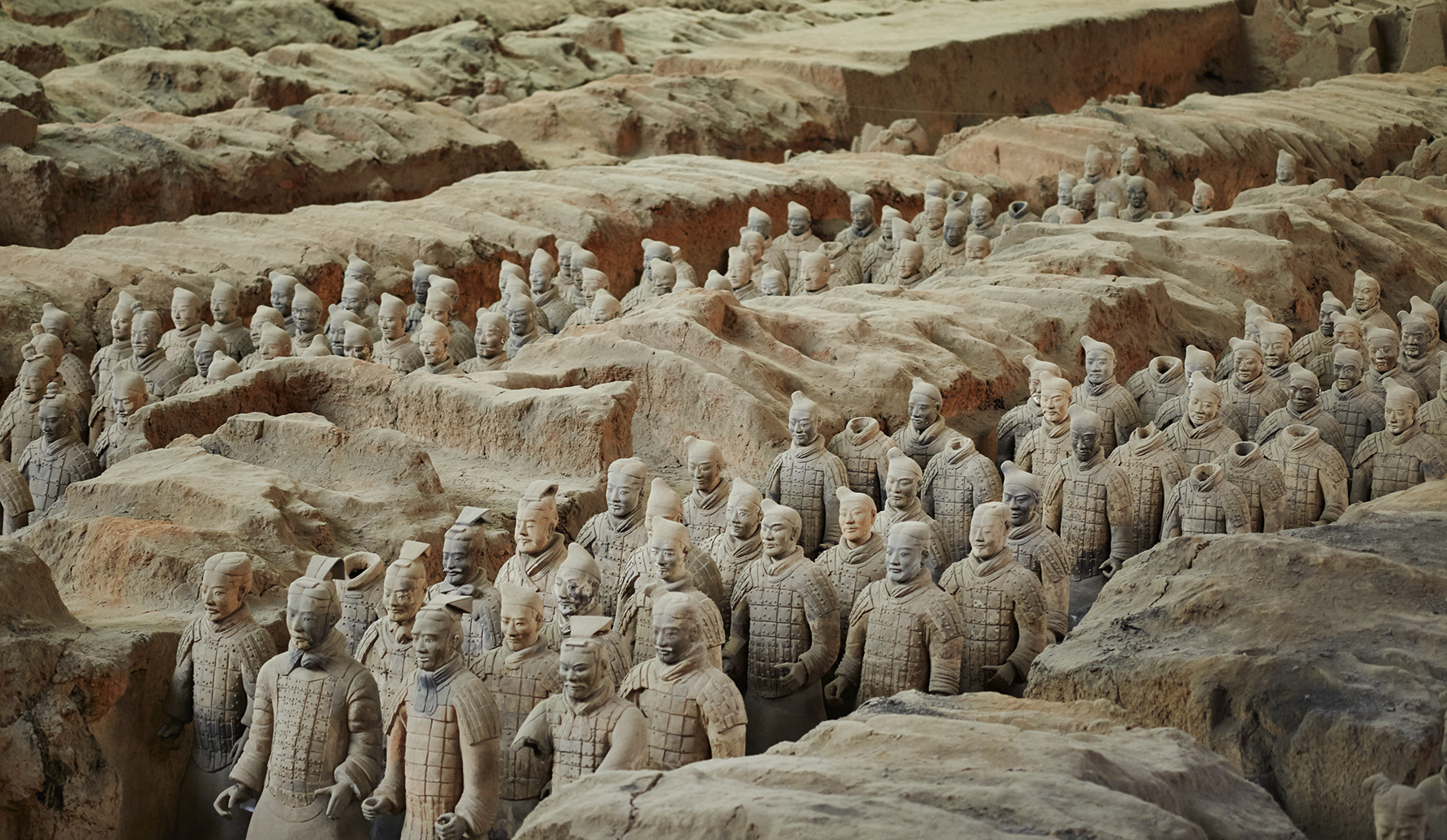 a group of terracotta warriors with Terracotta Army in the background