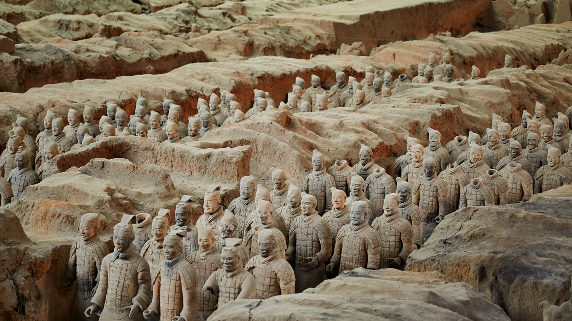 a group of terracotta warriors with Terracotta Army in the background