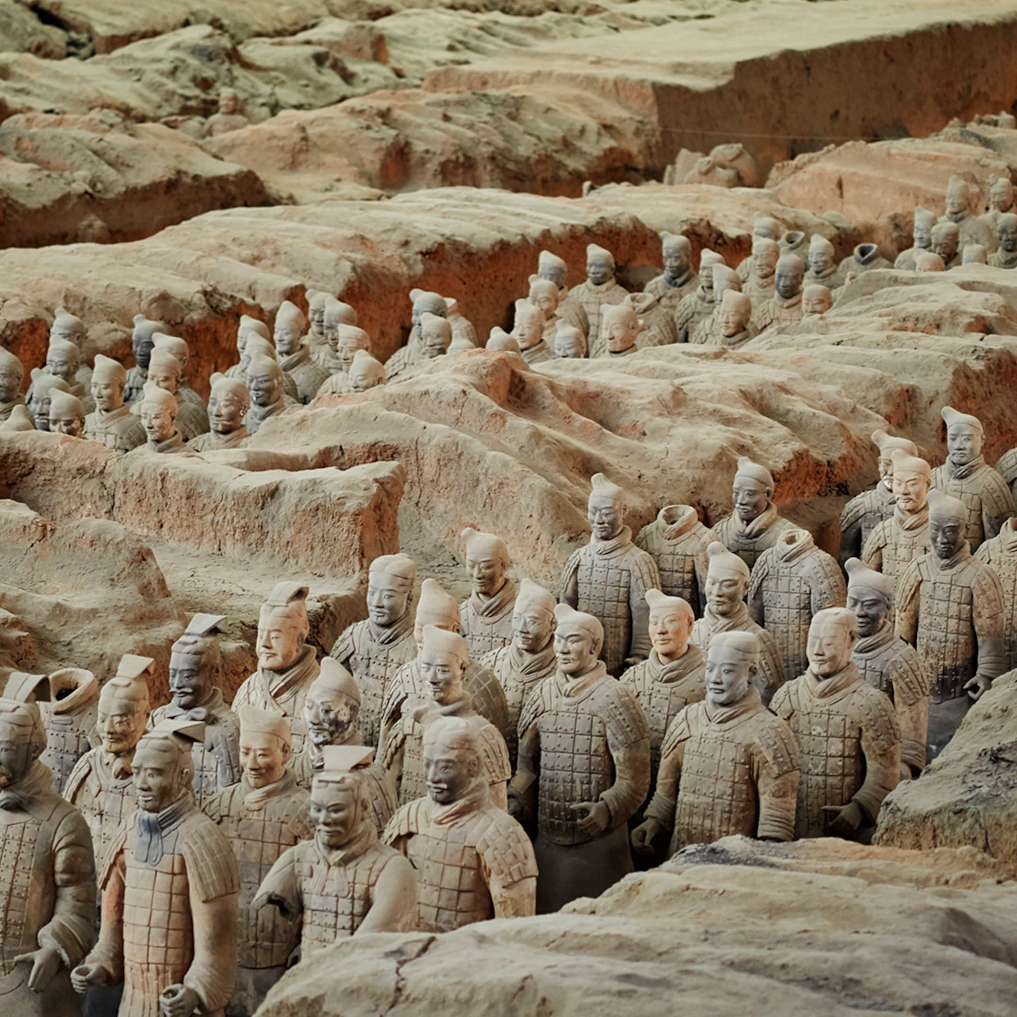 a group of terracotta warriors with Terracotta Army in the background