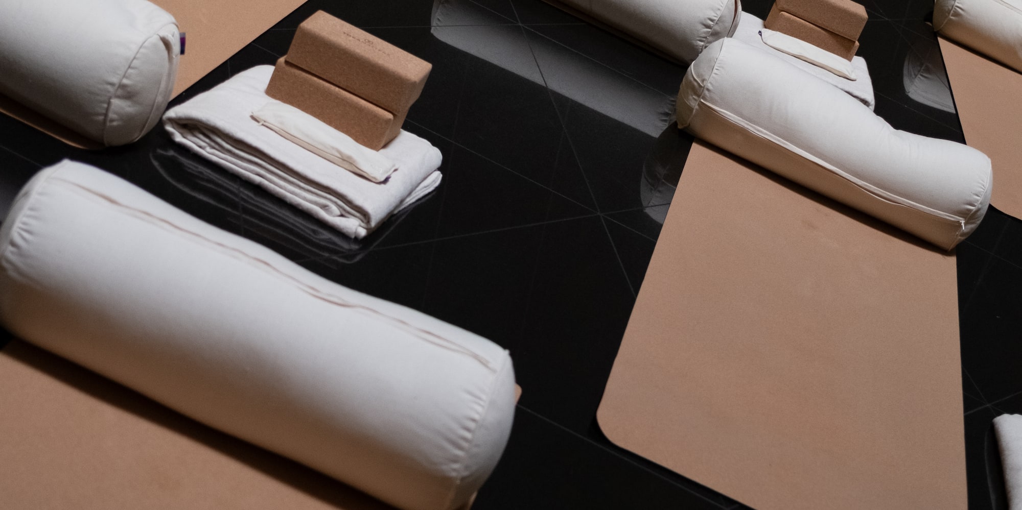 a group of white pillows on a black surface