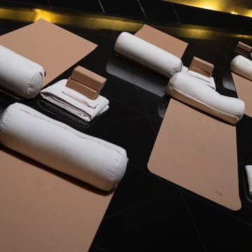 a group of white pillows on a black surface