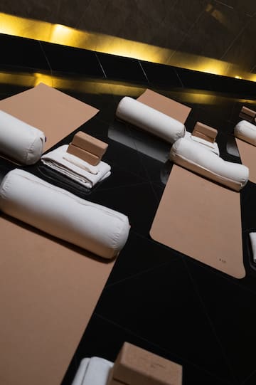 a group of white pillows on a black surface