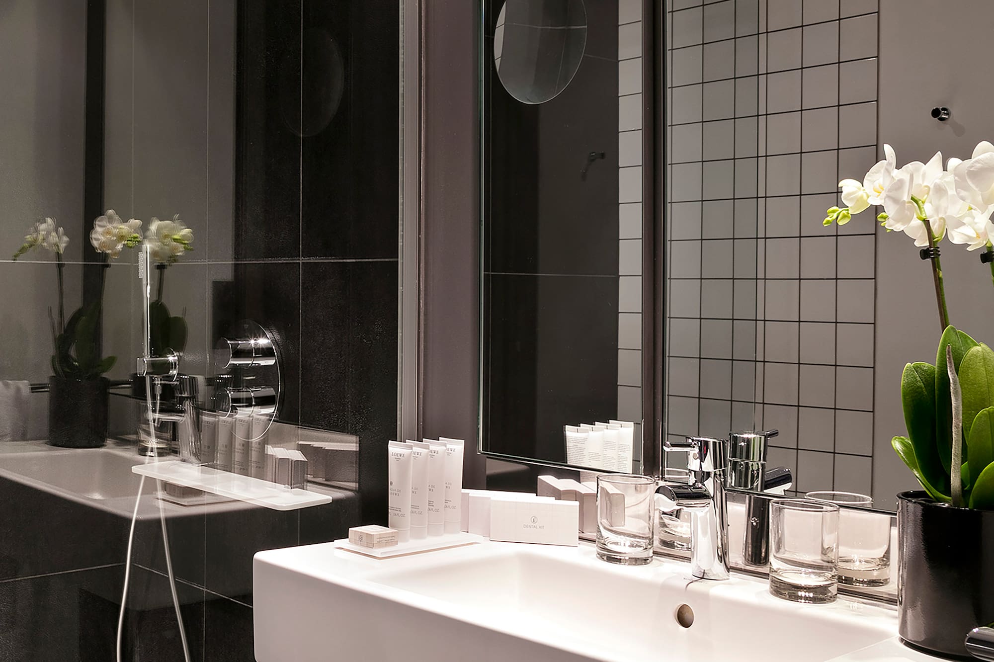 a bathroom with a sink and shower