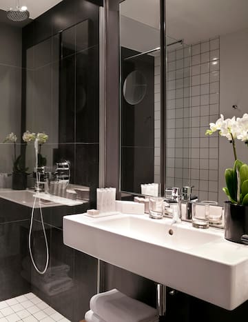 a bathroom with a sink and shower