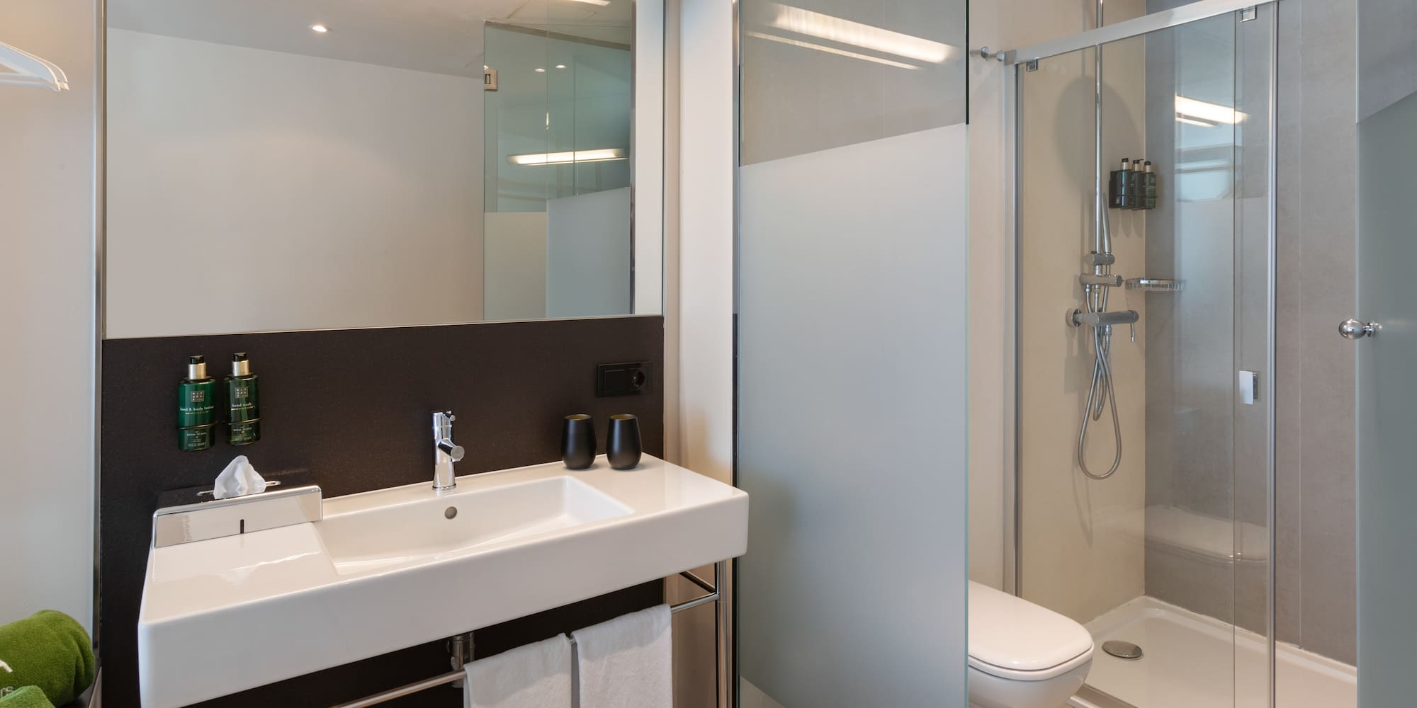 a bathroom with a shower and sink