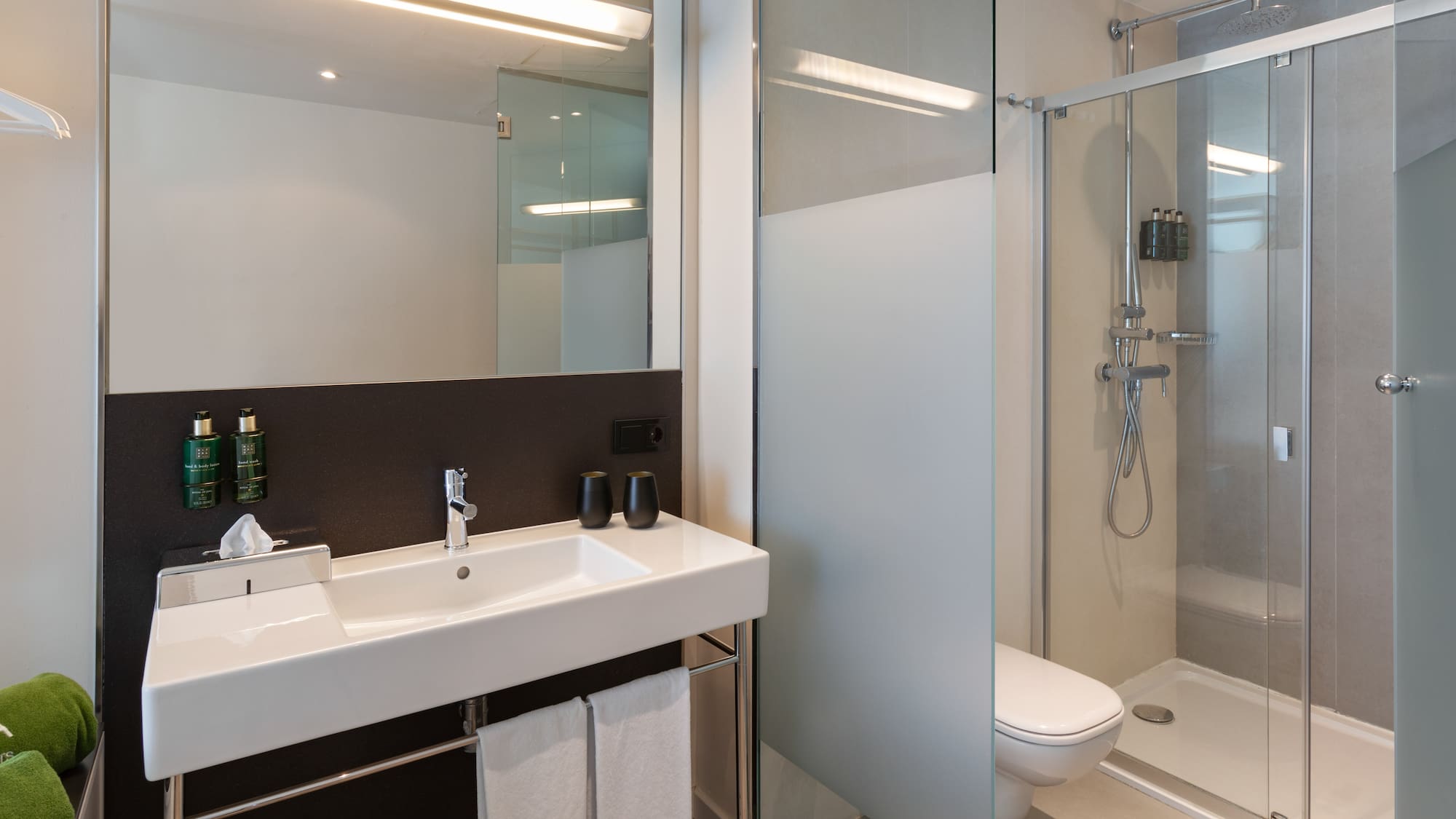 a bathroom with a shower and sink