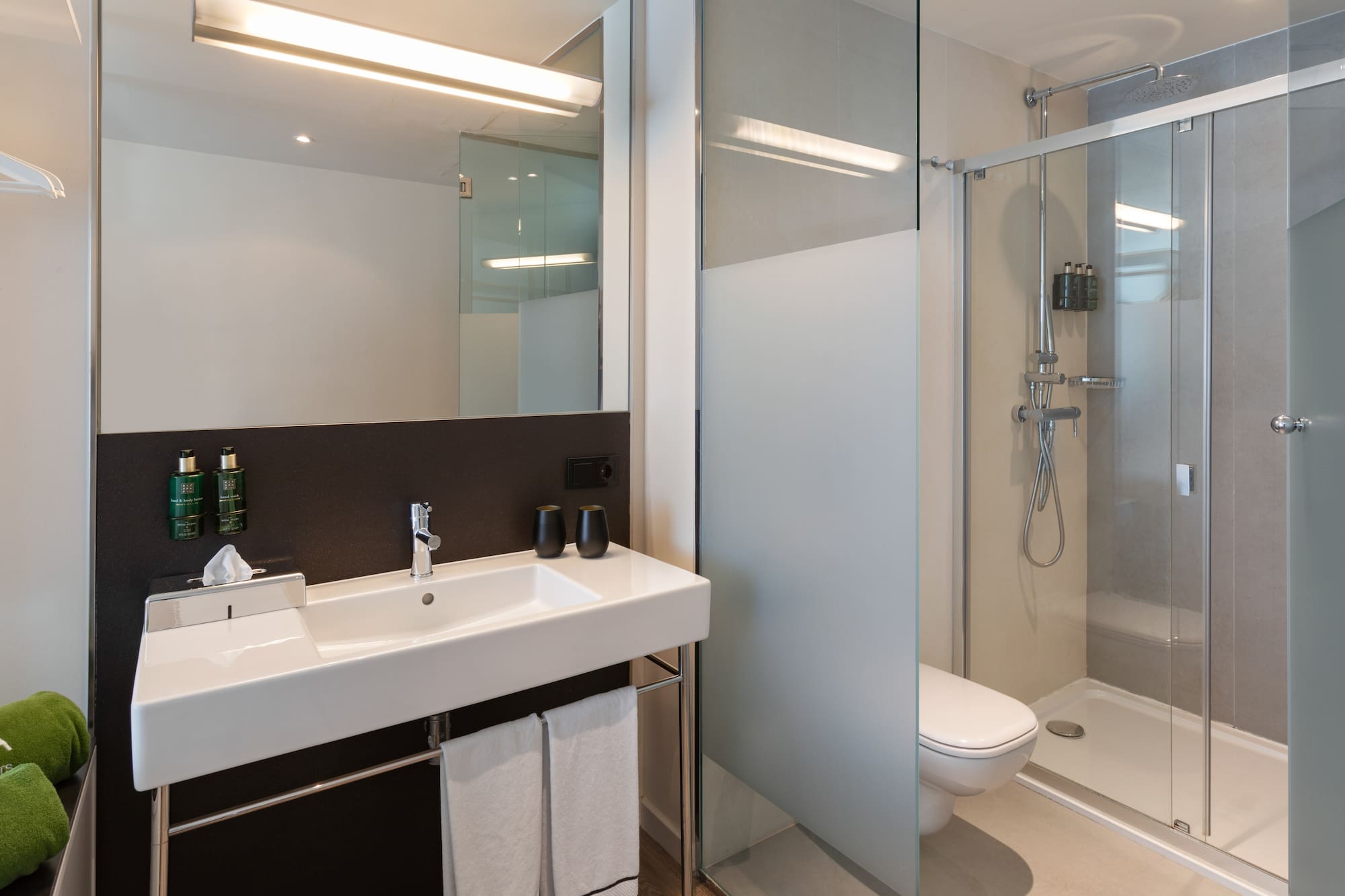 a bathroom with a shower and sink