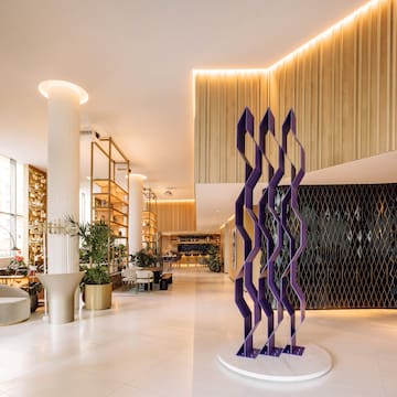 a large room with a purple sculpture