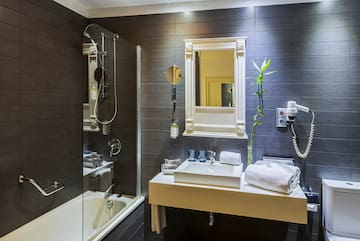 a bathroom with a shower and sink