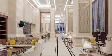 a room with a large wall and a television