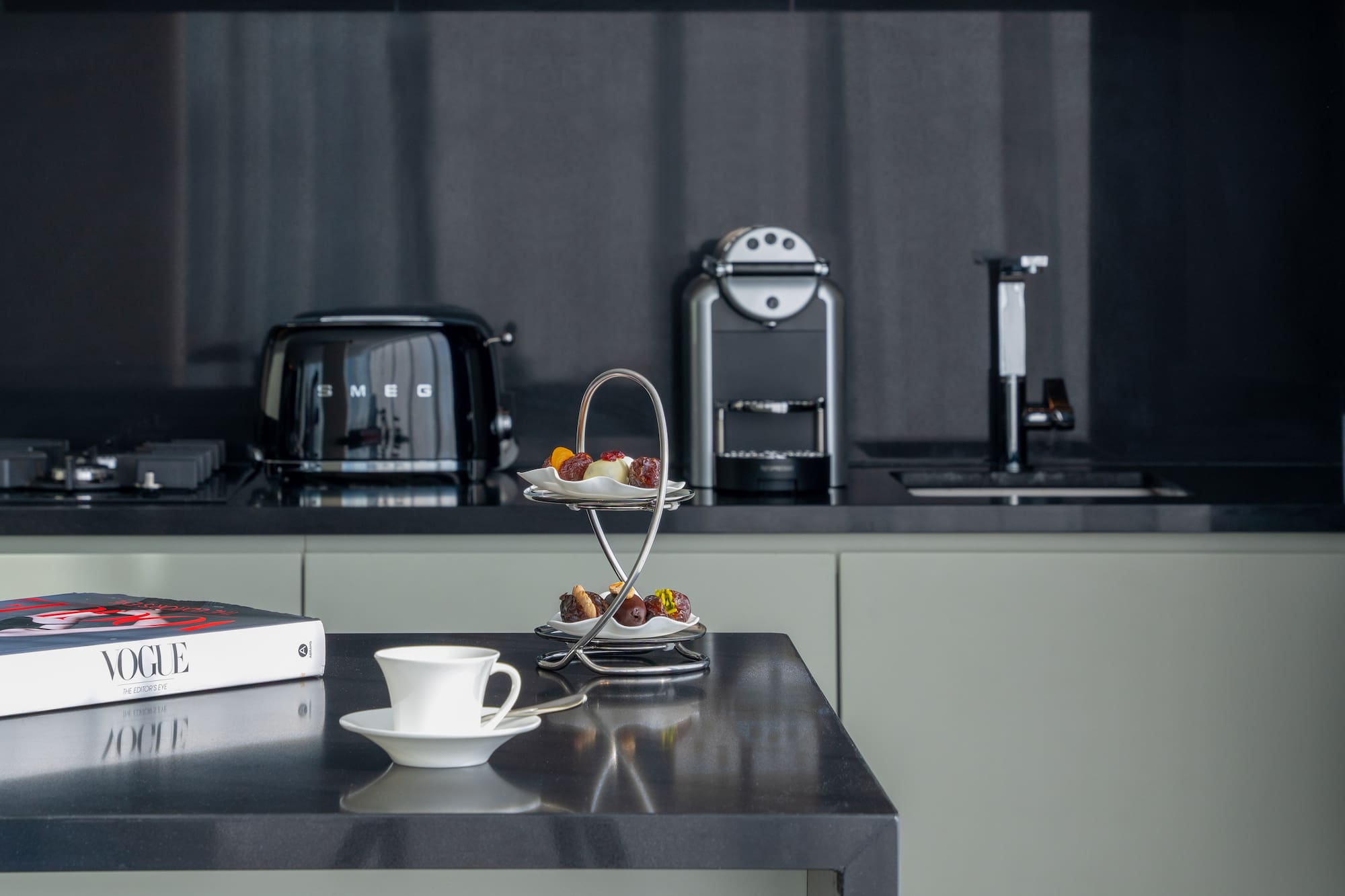 a coffee cup and saucer on a table in a kitchen