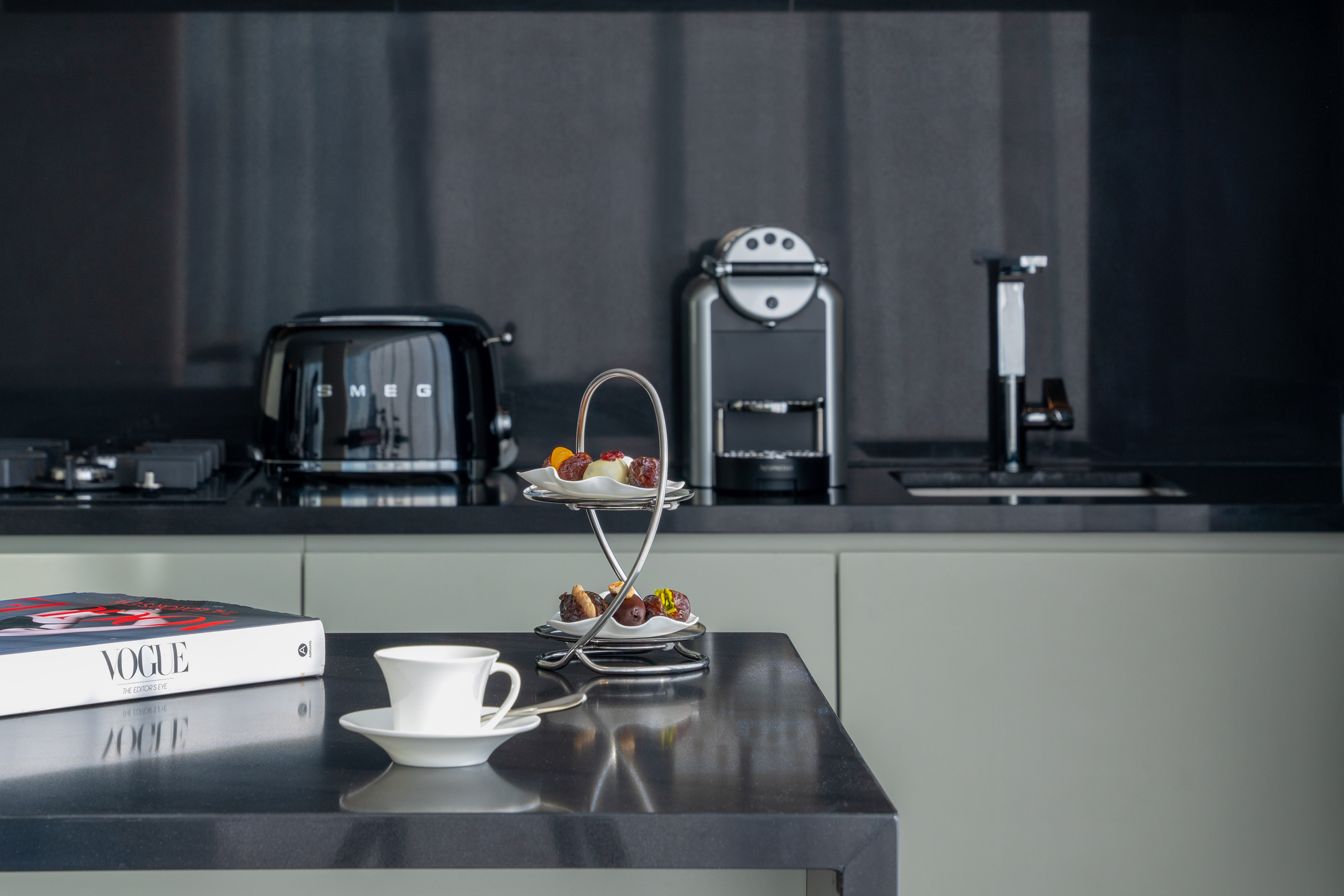 a coffee cup and saucer on a table in a kitchen