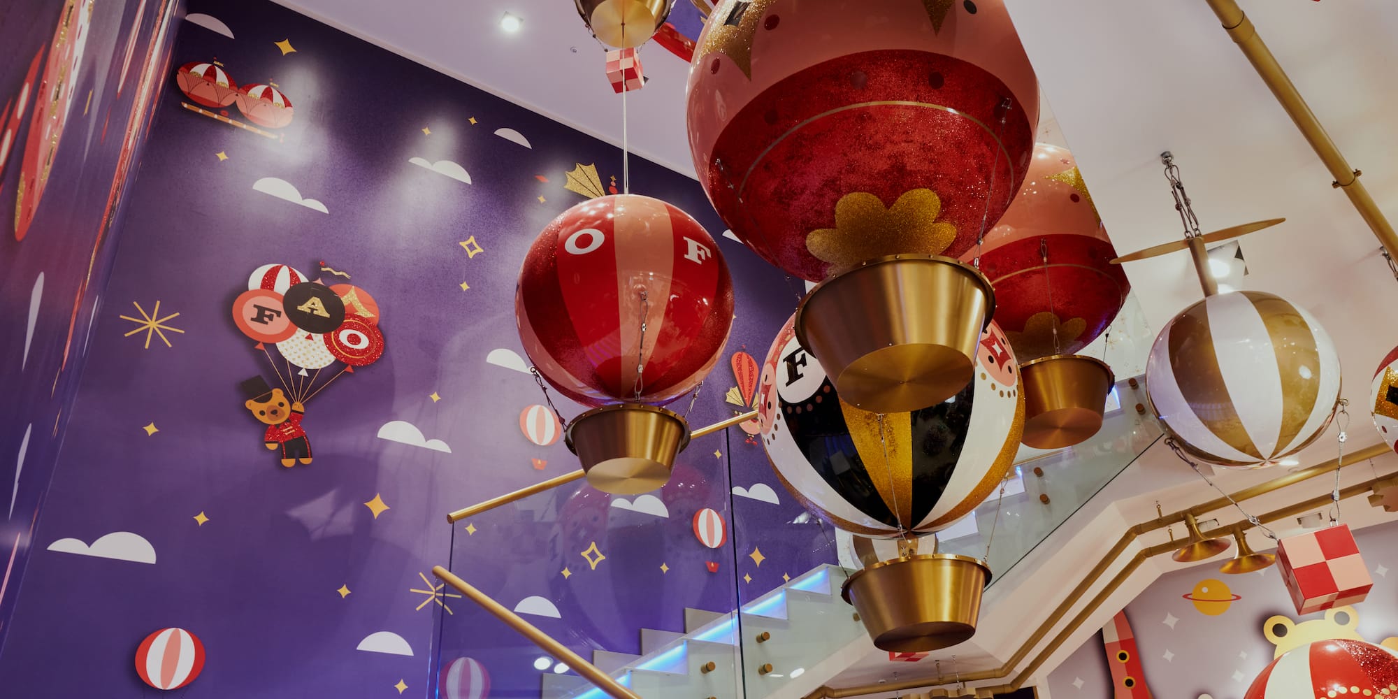 a group of balloons from a staircase