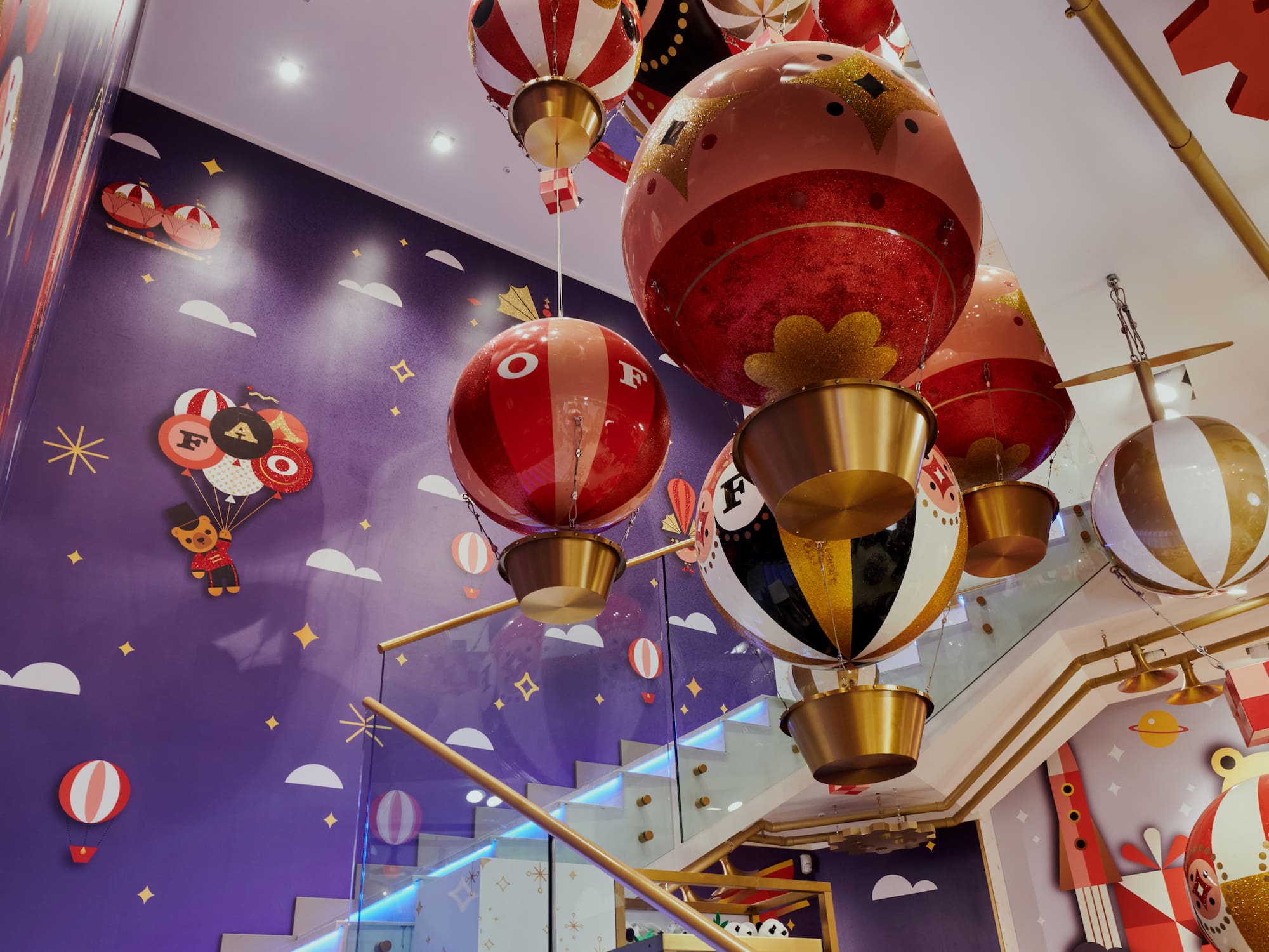 a group of balloons from a staircase