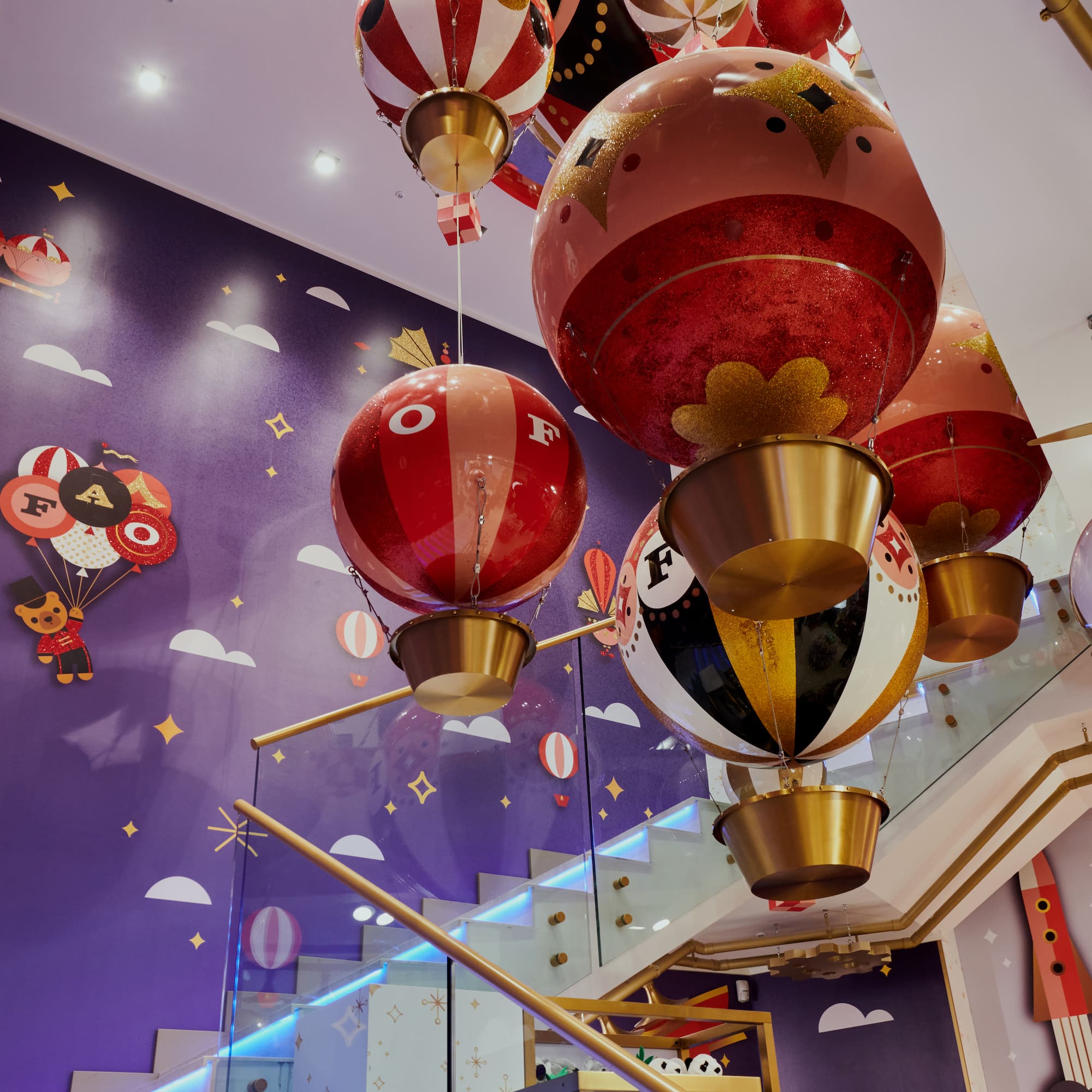 a group of balloons from a staircase