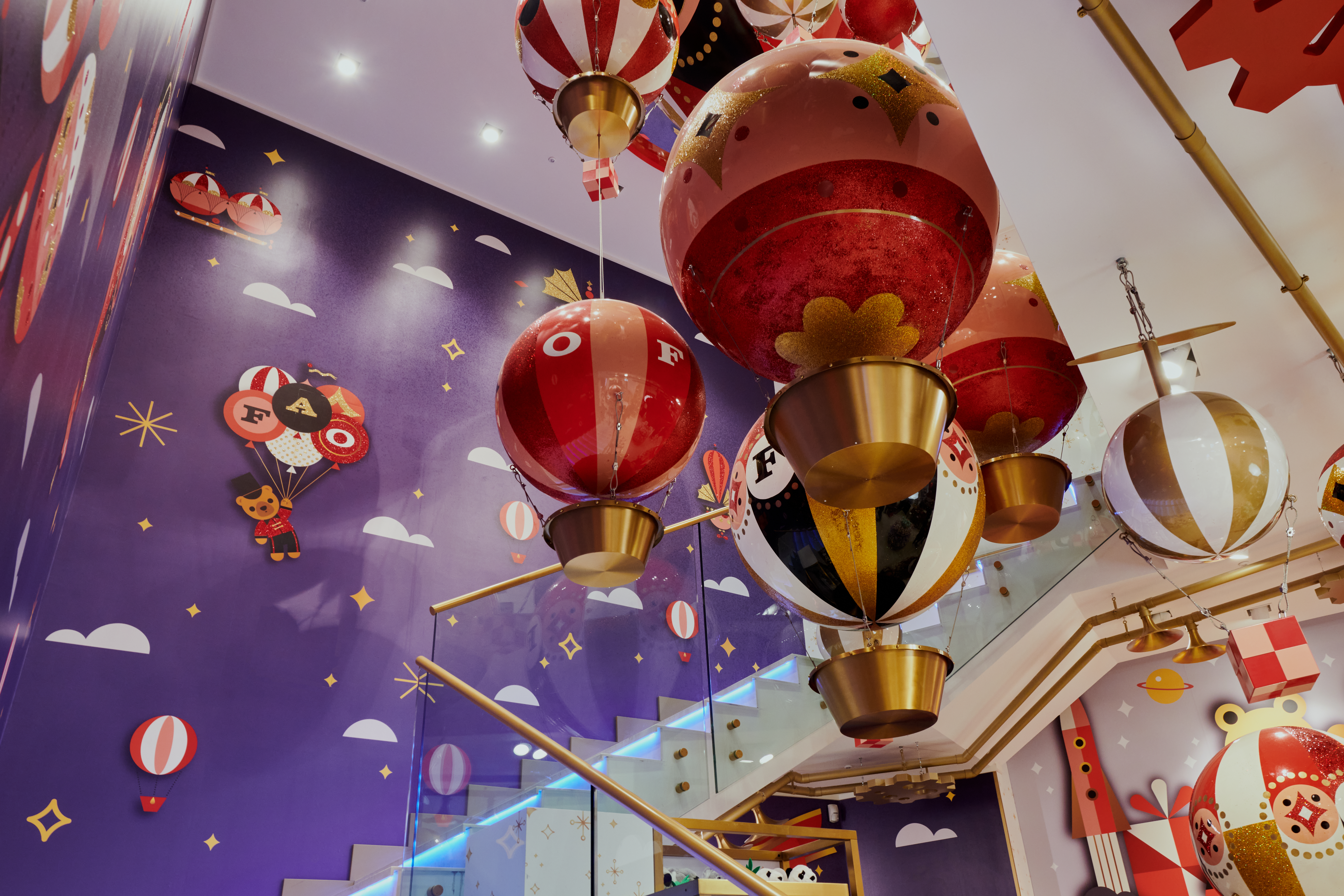 a group of balloons from a staircase