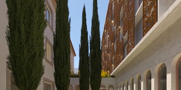 a courtyard with trees and plants