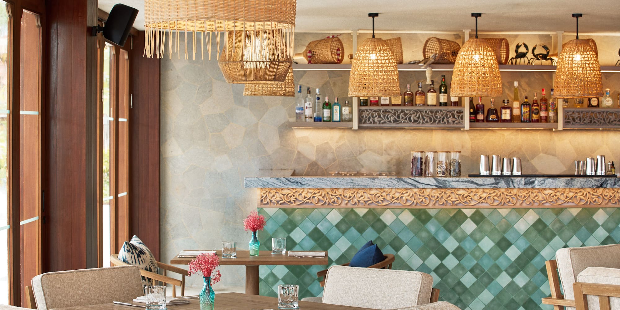 a restaurant with wicker chairs and tables