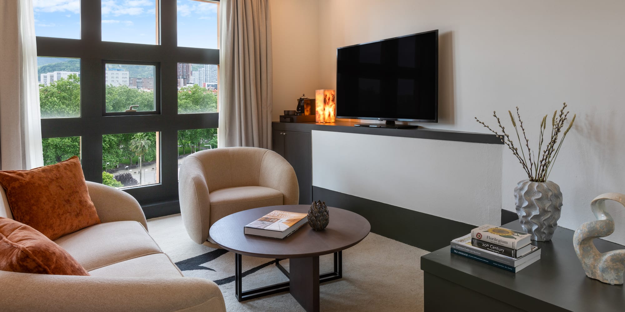 a living room with a television and a couch