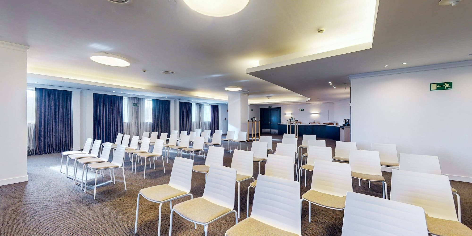 a room with white chairs