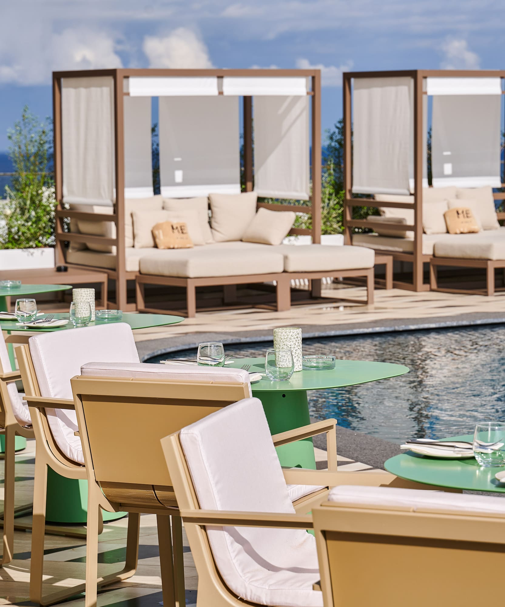 a pool with tables and chairs