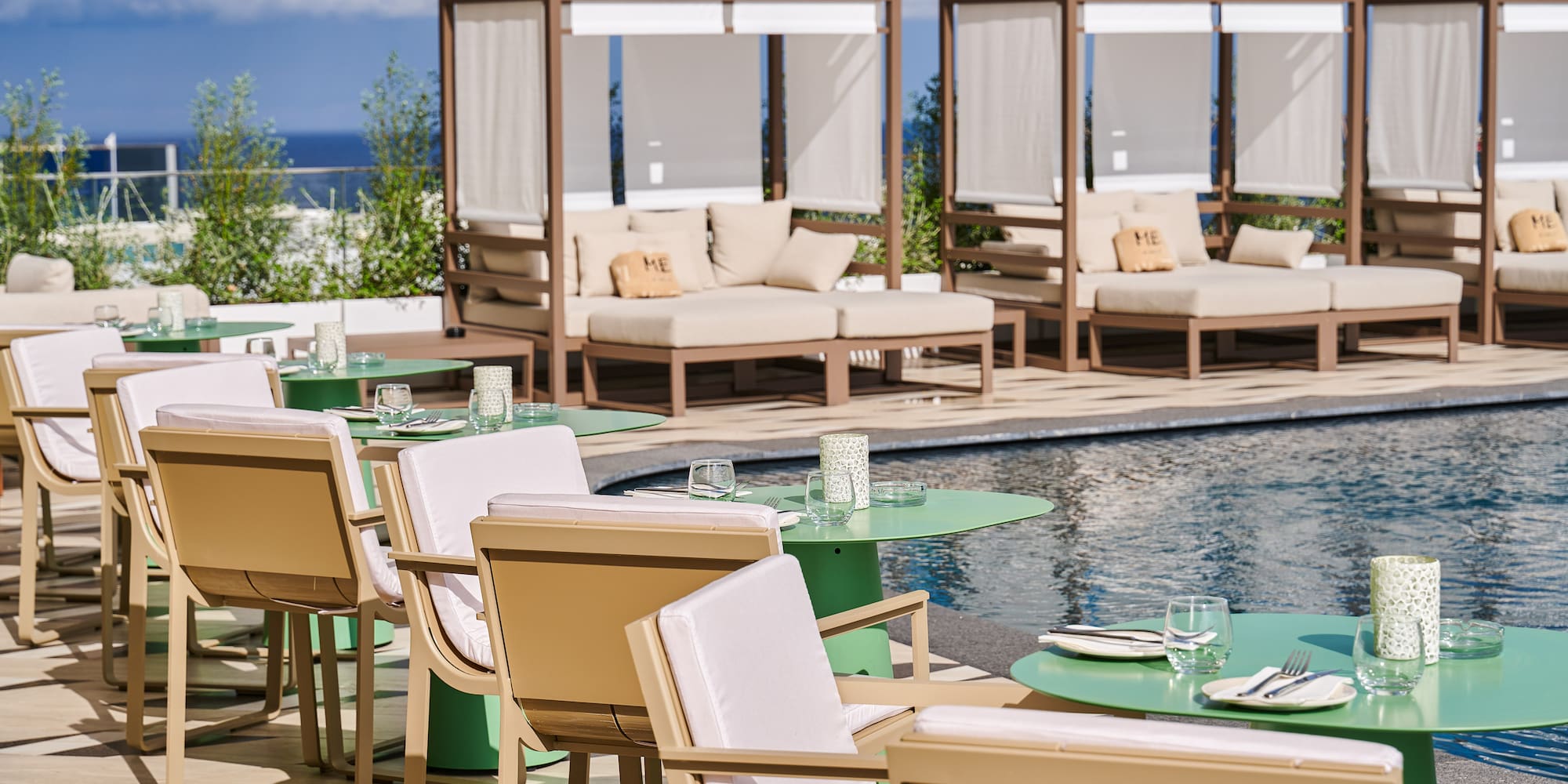 a pool with tables and chairs
