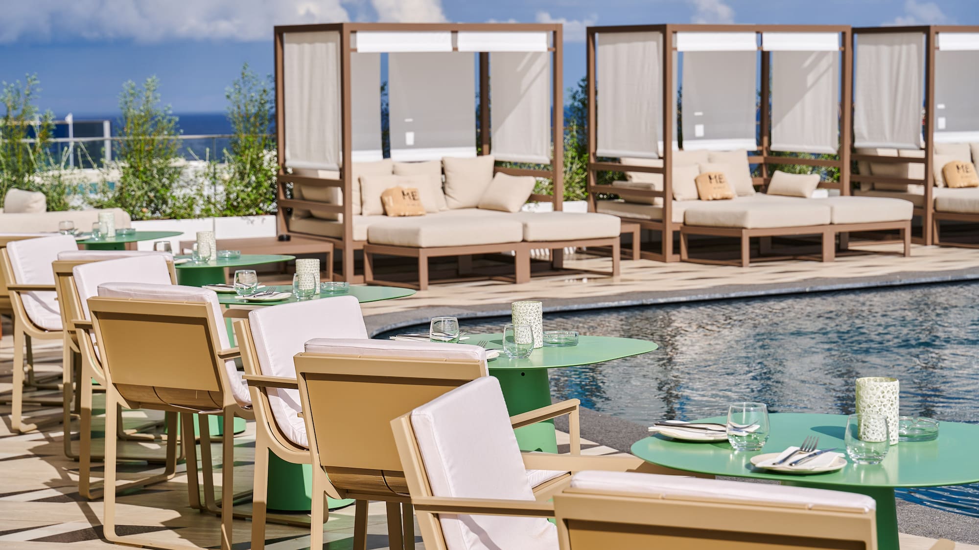 a pool with tables and chairs