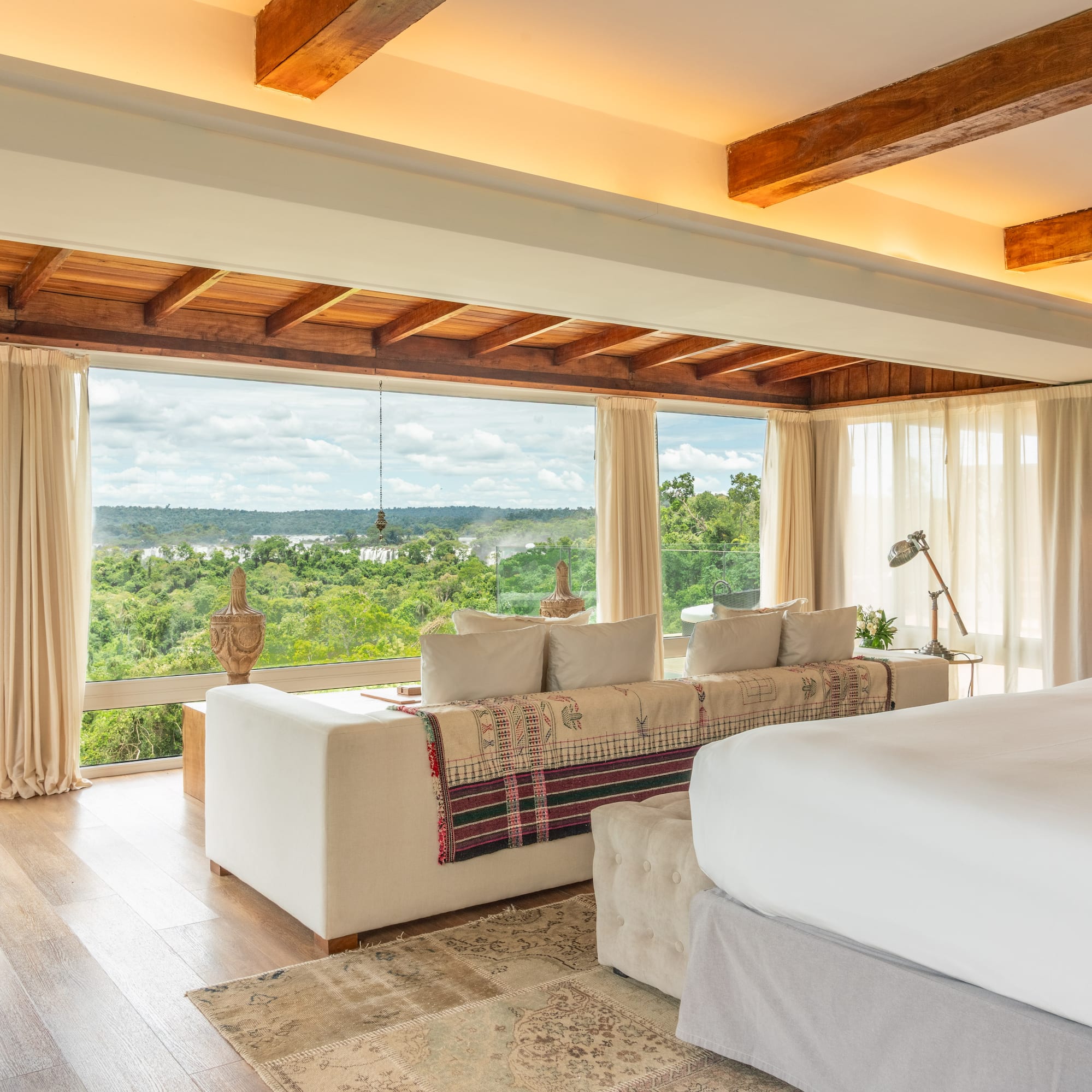 a room with a large bed and a large window