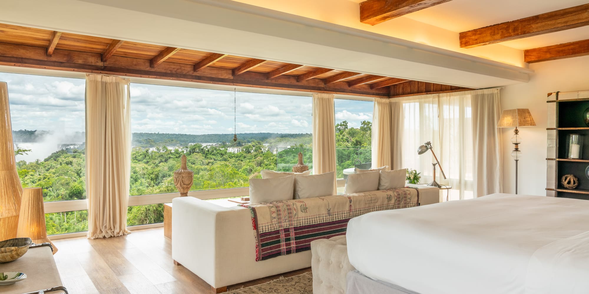 a room with a large bed and a large window