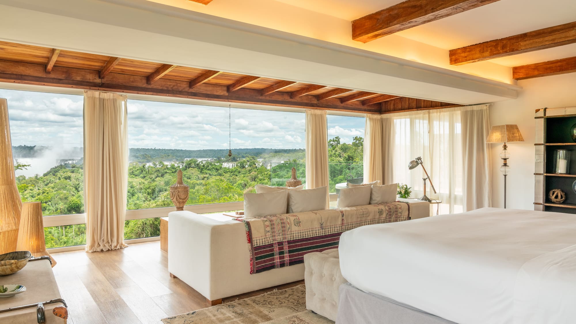 a room with a large bed and a large window