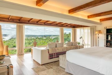 a room with a large bed and a large window