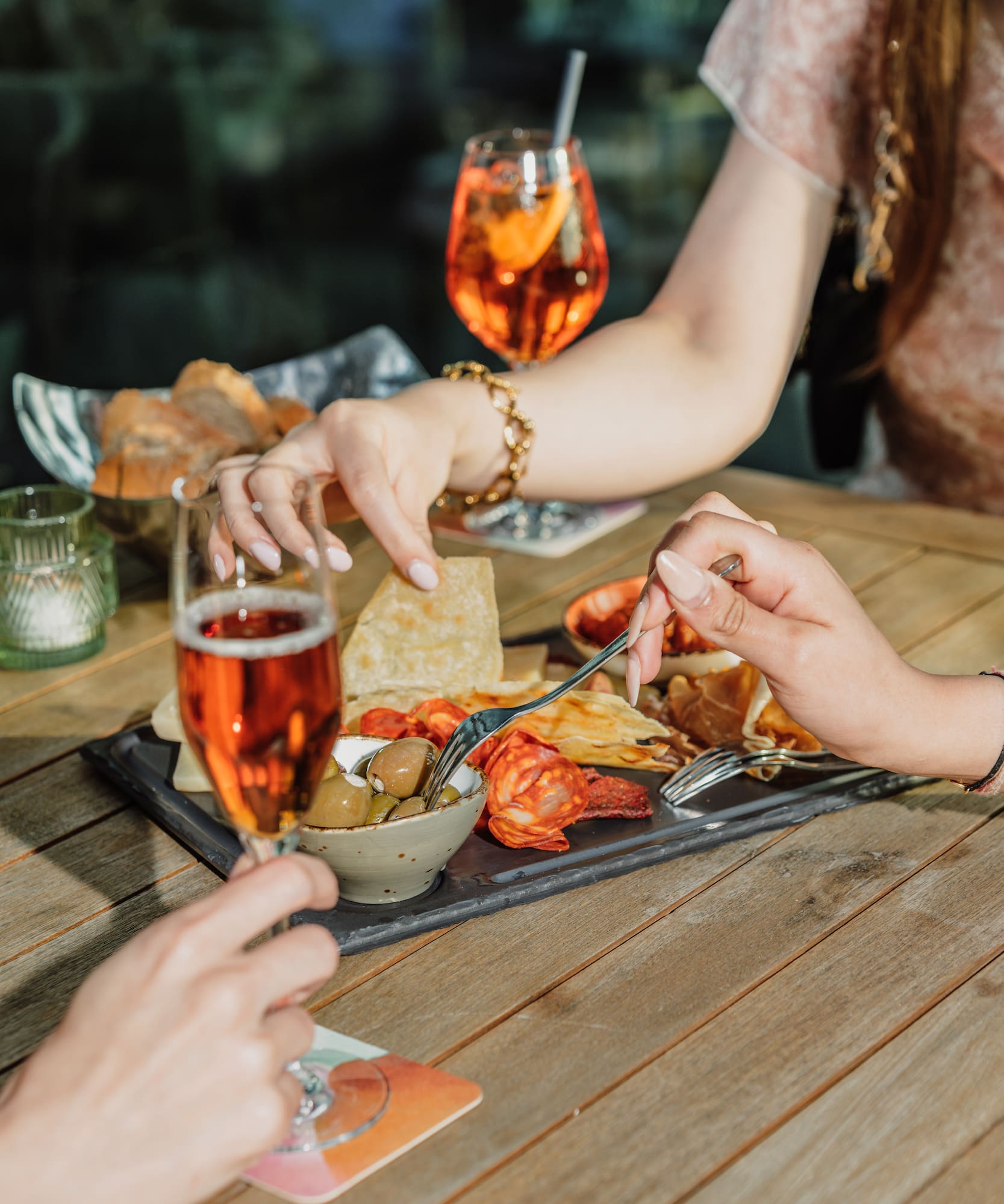 a group of people eating food at a table