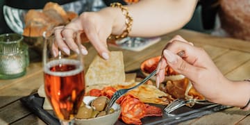 a group of people eating food at a table