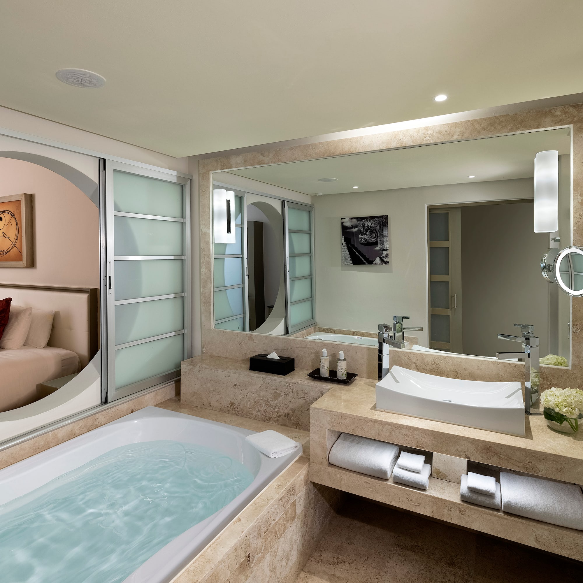 a bathroom with a bathtub and a mirror