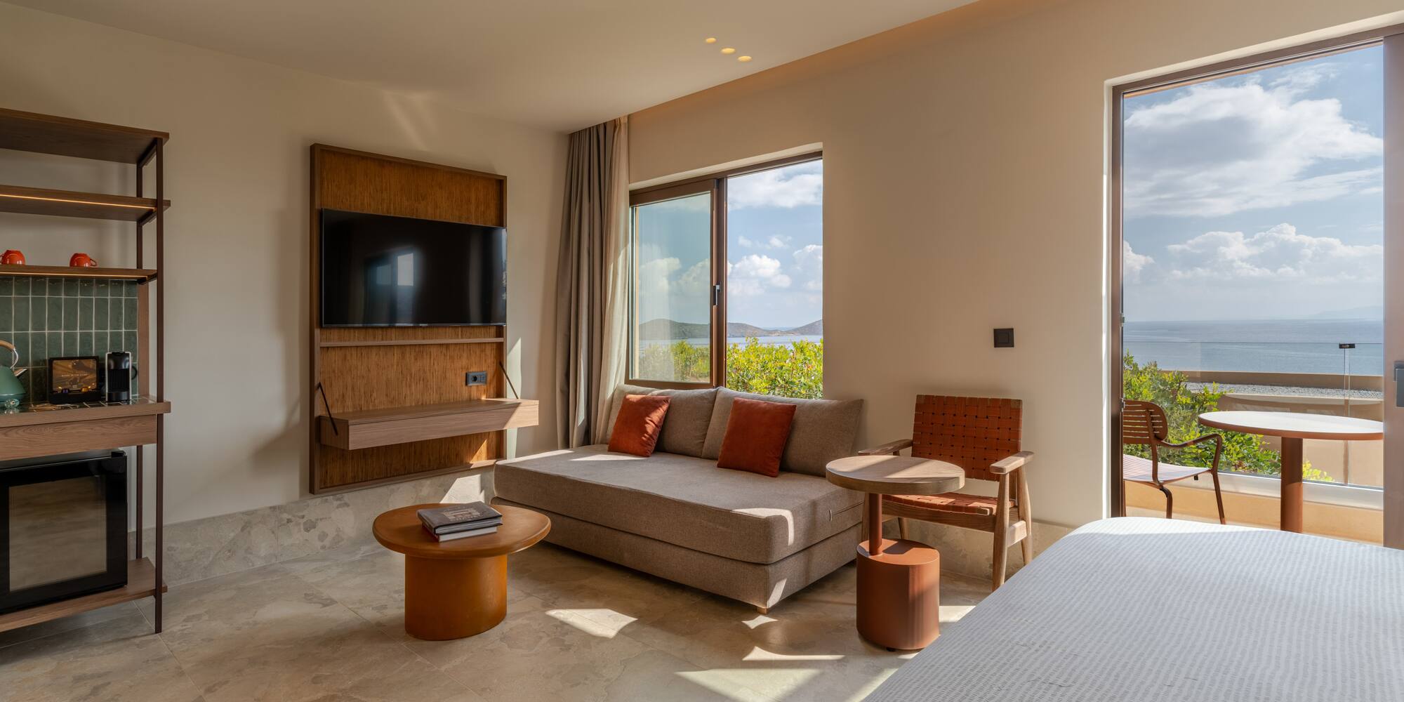 a room with a bed and a television