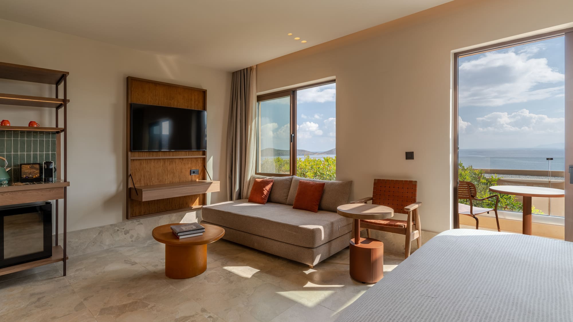 a room with a bed and a television